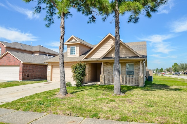 view of front of property with brick siding, covered porch, an attached garage, a front yard, and driveway