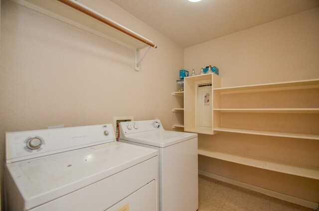 laundry room with laundry area and washing machine and clothes dryer