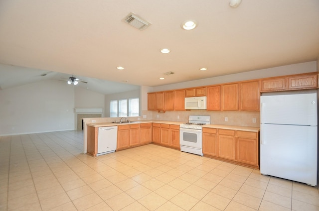 kitchen featuring light countertops, visible vents, vaulted ceiling, a sink, and white appliances