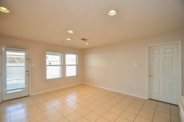 spare room with light tile patterned flooring, baseboards, visible vents, and recessed lighting