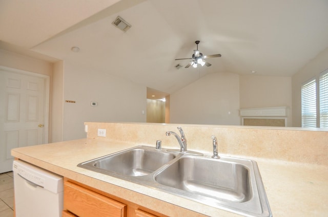 kitchen with white dishwasher, visible vents, light countertops, and a sink