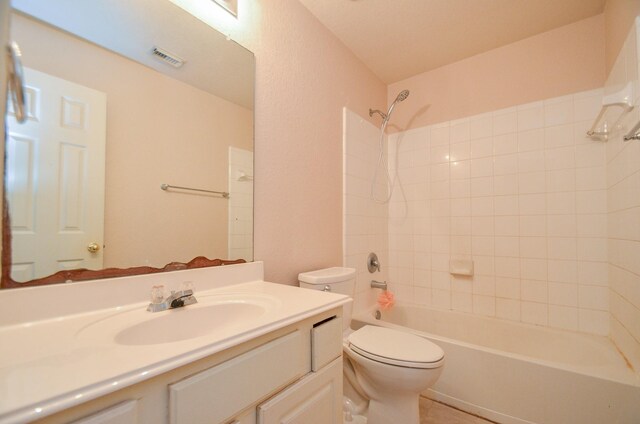 bathroom featuring visible vents, shower / bathing tub combination, vanity, and toilet