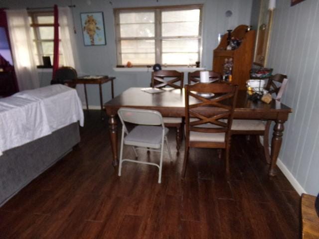 dining space with dark hardwood / wood-style floors