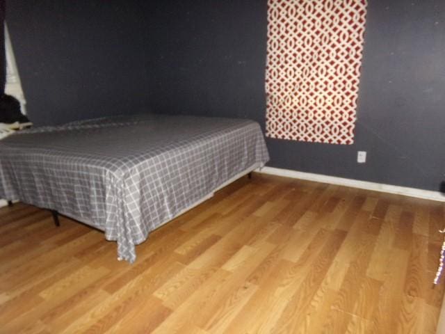 bedroom featuring hardwood / wood-style floors