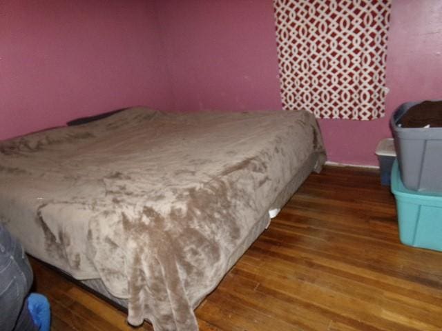 bedroom featuring dark hardwood / wood-style floors