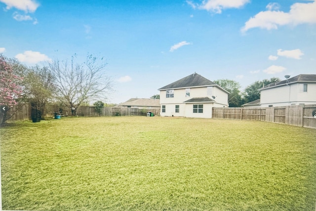 view of yard featuring a fenced backyard