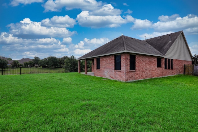 view of property exterior featuring a lawn