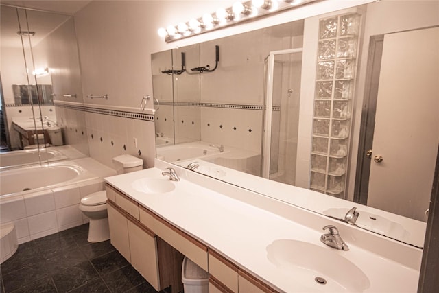 full bathroom featuring tile patterned floors, vanity, plus walk in shower, and toilet