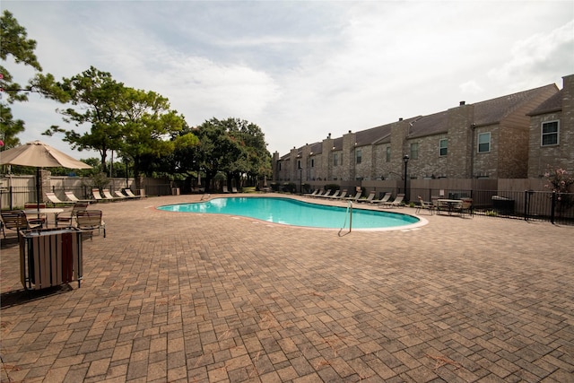 view of swimming pool with a patio area