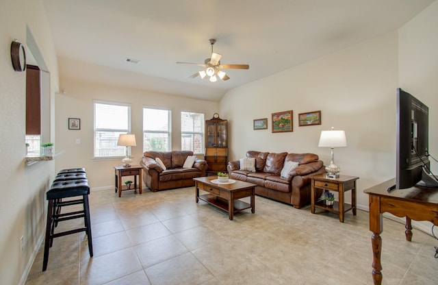 living area featuring a ceiling fan, baseboards, visible vents, and plenty of natural light