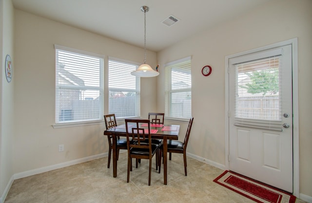 dining space with baseboards and visible vents