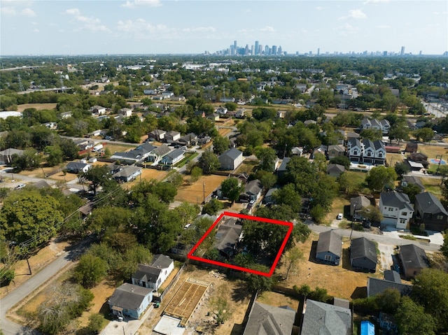 833 E 39th St, Houston, TX 77022 - aerial view of residential area with property boundaries highlighted and skyline