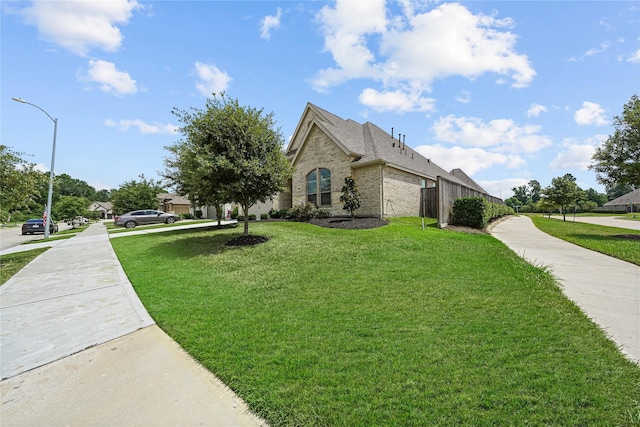 view of side of property featuring a yard