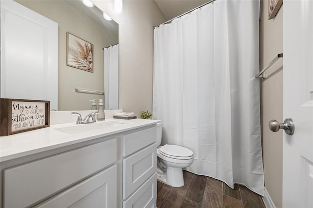 bathroom with toilet and vanity