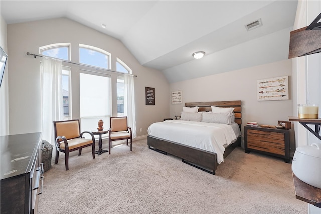 carpeted bedroom featuring lofted ceiling