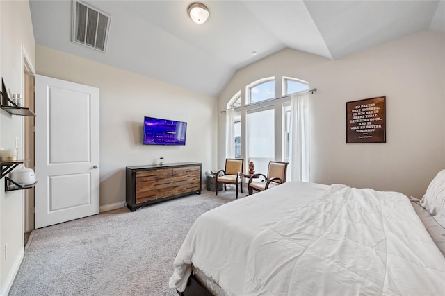 carpeted bedroom with vaulted ceiling