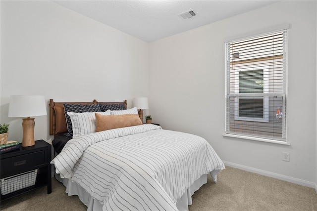 bedroom featuring light colored carpet