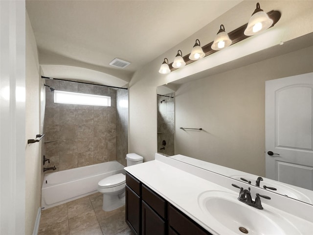 full bathroom featuring toilet, vanity, and tiled shower / bath combo