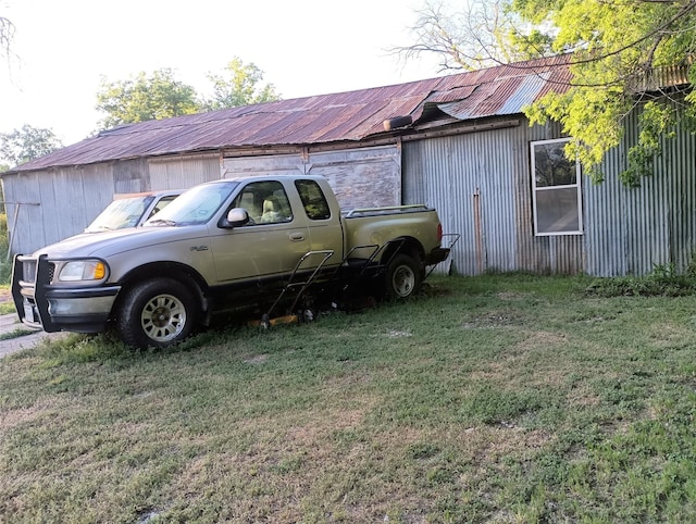 view of car parking with a yard