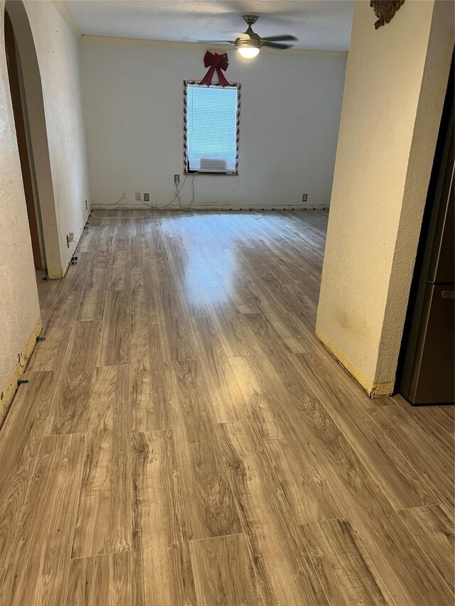 spare room with ceiling fan and light hardwood / wood-style flooring