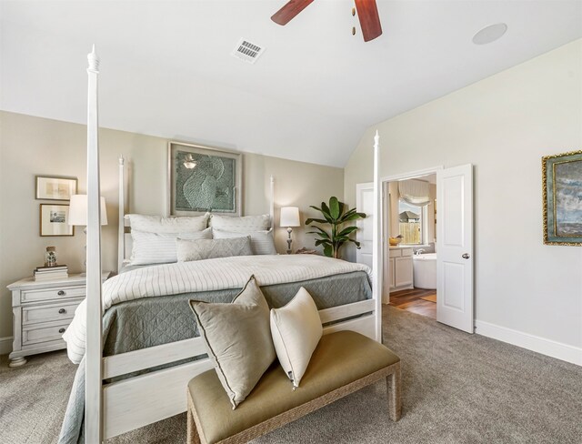 bedroom featuring carpet flooring, ceiling fan, connected bathroom, and vaulted ceiling