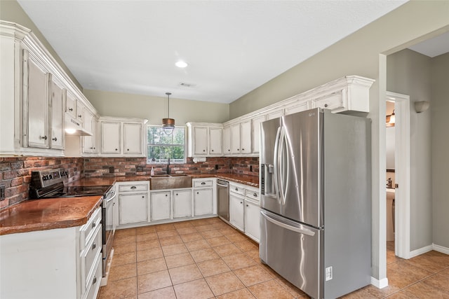 kitchen featuring sink, white cabinetry, and stainless steel appliances