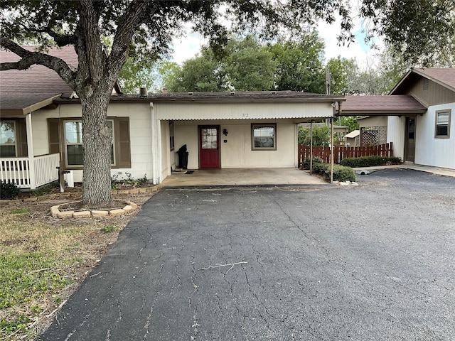 ranch-style house with a carport