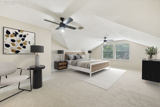 carpeted bedroom with ceiling fan and lofted ceiling