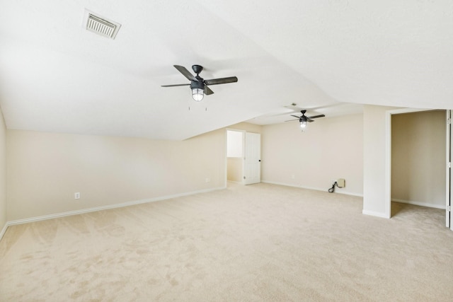 interior space featuring light carpet and lofted ceiling