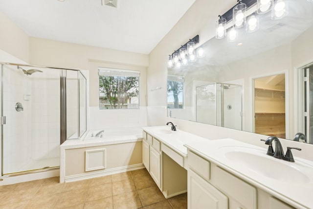 bathroom with tile patterned flooring, vanity, and independent shower and bath