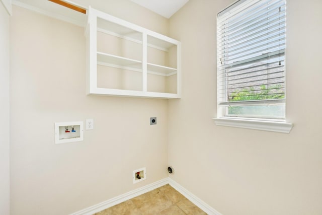 clothes washing area with hookup for an electric dryer, light tile patterned floors, and washer hookup