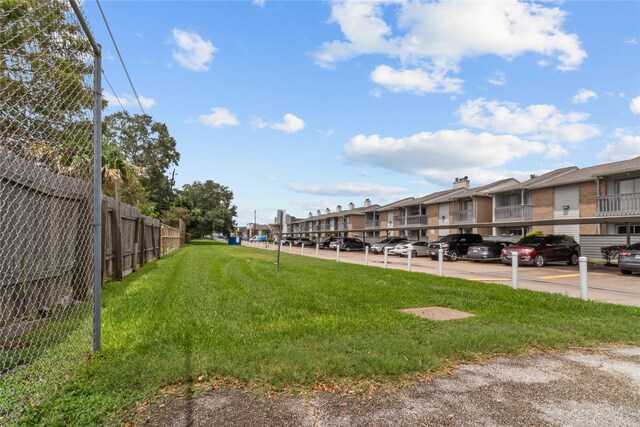 view of property's community featuring a lawn