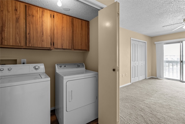 laundry area featuring carpet flooring, ceiling fan, cabinets, and a textured ceiling