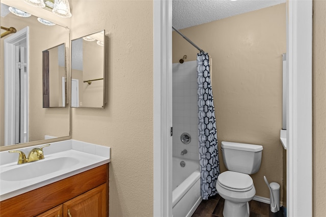 full bathroom with a textured ceiling, hardwood / wood-style floors, toilet, shower / bath combo with shower curtain, and vanity