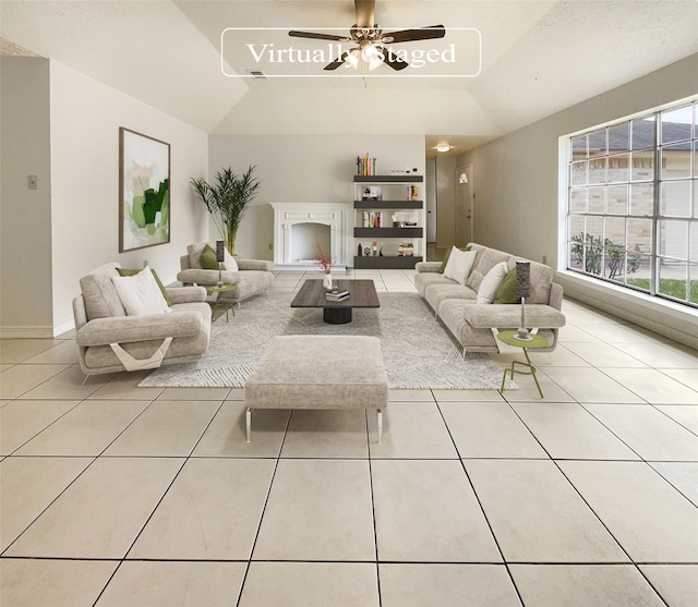 tiled living room featuring ceiling fan and a healthy amount of sunlight