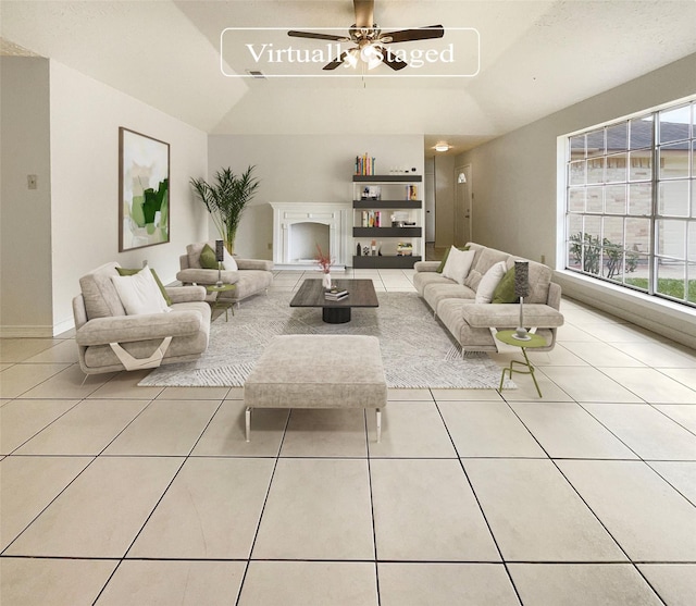 tiled living room with ceiling fan