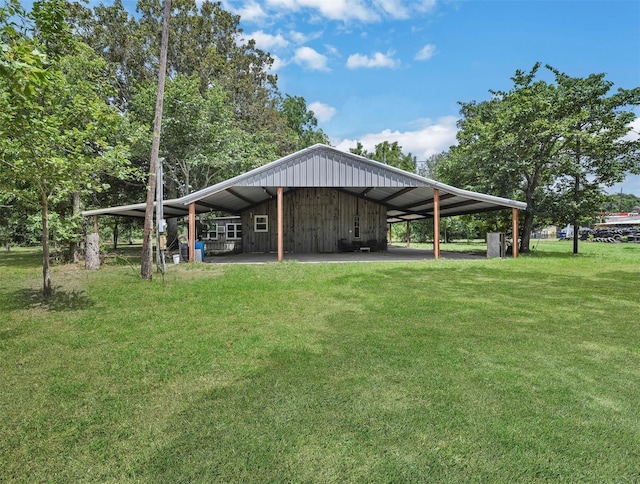 view of property's community with a carport and a lawn