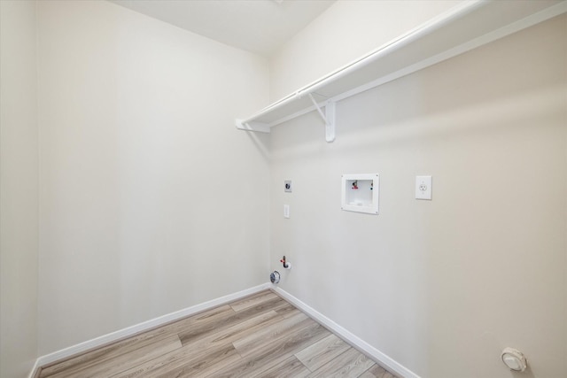 washroom with light hardwood / wood-style floors, gas dryer hookup, washer hookup, and hookup for an electric dryer