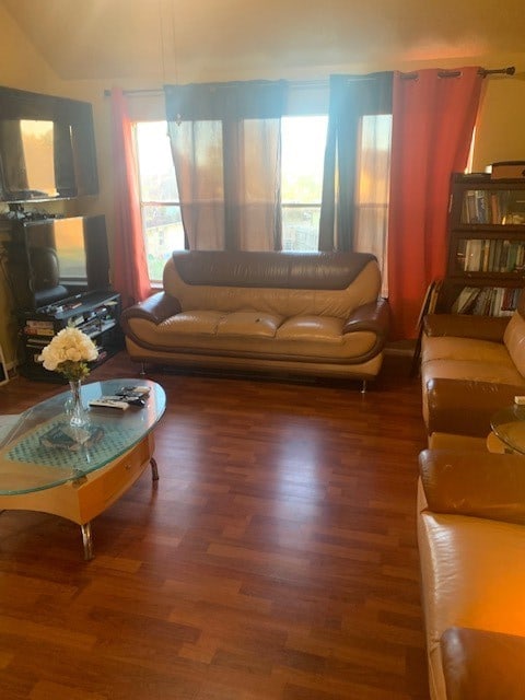 living room featuring dark wood-type flooring