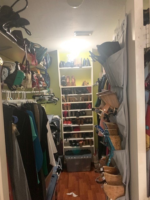 spacious closet featuring hardwood / wood-style floors