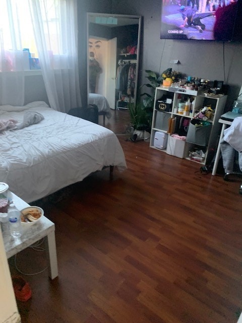 bedroom featuring dark hardwood / wood-style floors