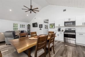 dining room with high vaulted ceiling, dark wood-type flooring, and ceiling fan