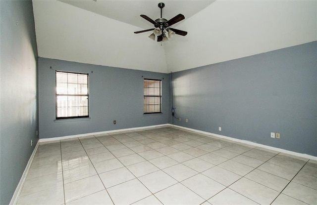 tiled spare room featuring ceiling fan and vaulted ceiling