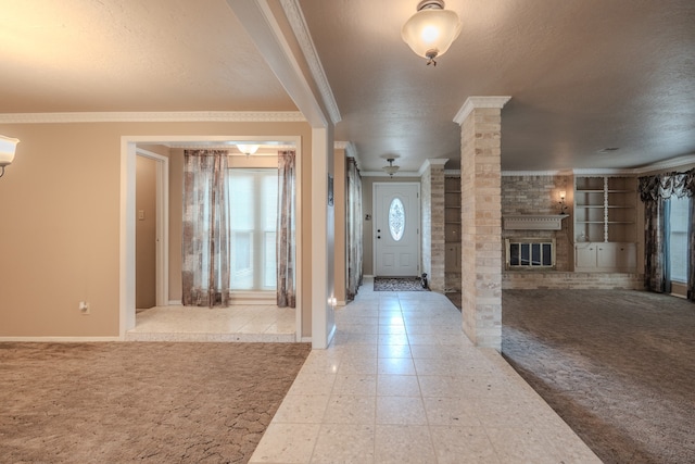 foyer featuring a fireplace, brick wall, crown molding, and light colored carpet