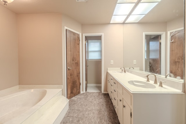 bathroom featuring double vanity and a bath