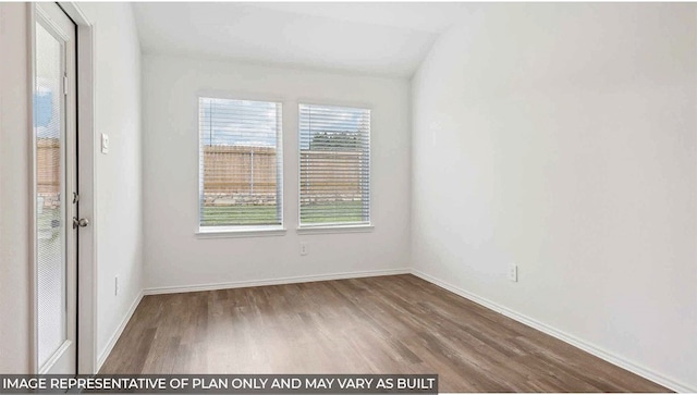 empty room featuring hardwood / wood-style flooring