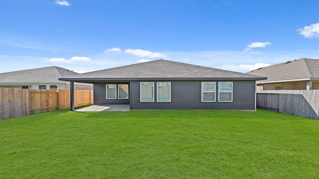 back of property featuring a patio area and a lawn