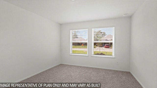 unfurnished room featuring carpet flooring