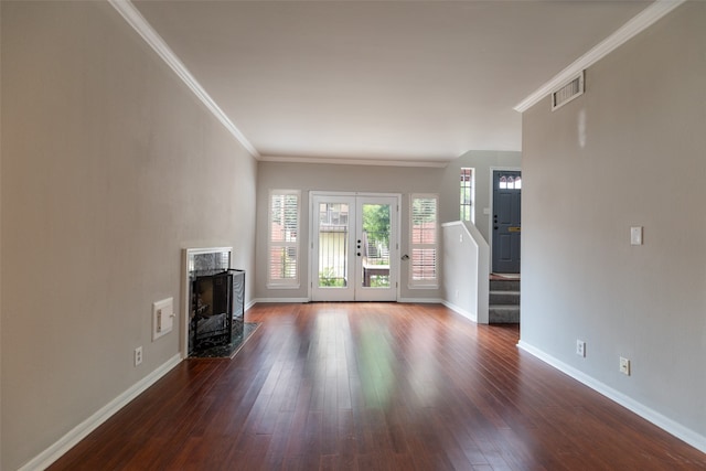 unfurnished living room featuring a premium fireplace, french doors, hardwood / wood-style flooring, and ornamental molding