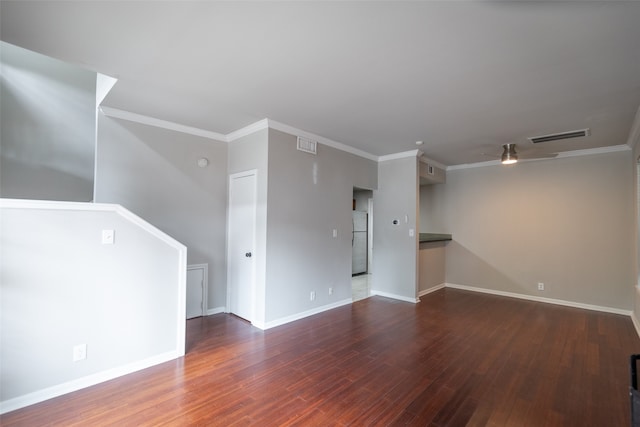 interior space with ceiling fan, hardwood / wood-style flooring, and ornamental molding